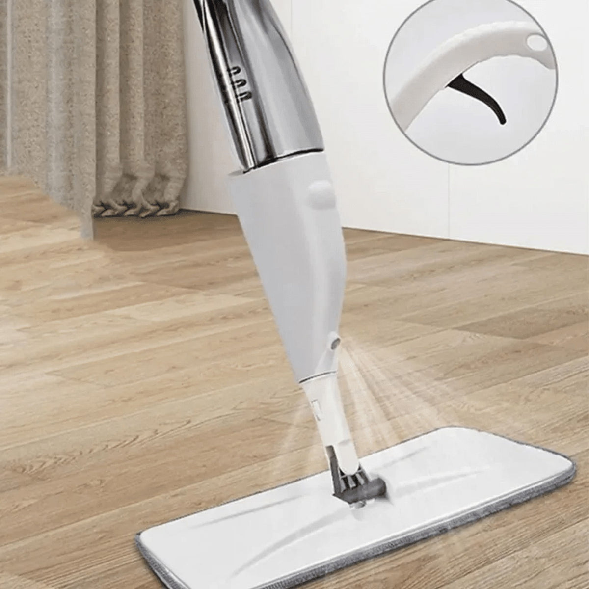 EasyClean spray mop applying a fine mist while cleaning a hard floor